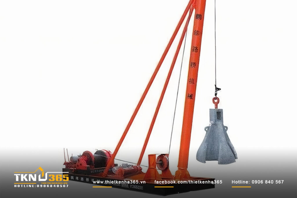 Máy khoan đập là thiết bị thi công cọc nhồi sử dụng mũi khoan dạng chùy nặng thả rơi tự do từ độ cao nhất định, tạo lực va đập mạnh để phá vỡ đất cứng hoặc tầng đá. (Ảnh sưu tầm) Máy khoan đập là thiết bị thi công cọc nhồi sử dụng mũi khoan dạng chùy nặng thả rơi tự do từ độ cao nhất định, tạo lực va đập mạnh để phá vỡ đất cứng hoặc tầng đá. - Các Loại Máy Khoan Cọc Nhồi: Ưu Nhược Điểm Chi Tiết 2025